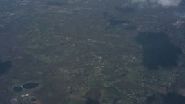 4K stock footage aerial video tilt to a cloud over rural Virginia, and tilt up to a wider view of small clouds over rural towns Aerial Stock Footage | WA006_005