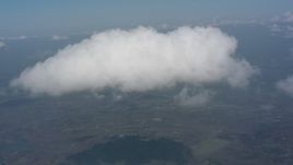 4K stock footage aerial video tilt from a misty cloud to approach a second cloud over Virginia Aerial Stock Footage | WA006_009