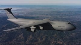 4K stock footage aerial video of tracking a Lockheed C-5 flying over hills in Northern California Aerial Stock Footage | WAAF01_C007_01172T