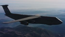 4K stock footage aerial video of a Lockheed C-5 in flight over mountains, Northern California Aerial Stock Footage | WAAF01_C030_0117Q9