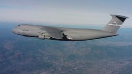 4K stock footage aerial video of a Lockheed C-5 in flight near mountains in Northern California Aerial Stock Footage | WAAF01_C035_0117ES