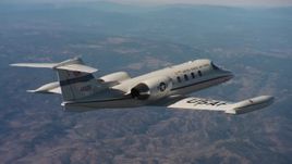 4K stock footage aerial video of flying around the tail of a Learjet C-21 over Northern California Aerial Stock Footage | WAAF02_C009_01170N