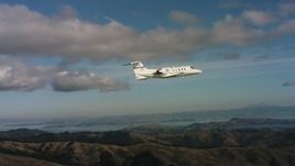 4K aerial stock footage video of a Learjet C-21 over the Marin Hills, California Aerial Stock Footage | WAAF02_C050_0117QE