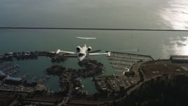 4K stock footage aerial video of a reverse view of a Learjet C-21 flying over the bay in Northern California Aerial Stock Footage | WAAF02_C054_0117PF_S000