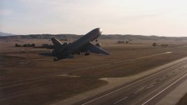 4K stock footage aerial video of a McDonnell Douglas KC-10 lifting off from Travis Air Force Base, California Aerial Stock Footage | WAAF03_C004_0118CL