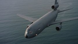 4K aerial ideo of flying around the nose of a McDonnell Douglas KC-10 over the ocean in Northern California Aerial Stock Footage | WAAF03_C044_01181Q