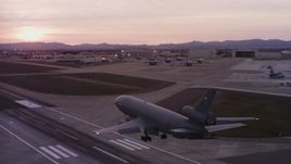 4K stock footage aerial video of a McDonnell Douglas KC-10 landing at Travis Air Force Base at sunset, California Aerial Stock Footage | WAAF03_C074_0118AU_S000