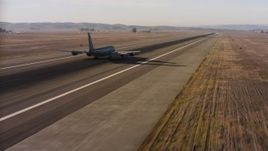 4K stock footage aerial video of a Boeing KC-135 lifting off from Travis Air Force Base, California Aerial Stock Footage | WAAF04_C007_01187P