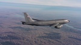 4K stock footage aerial video of a Boeing KC-135 flying over hills toward a bay in Northern California Aerial Stock Footage | WAAF04_C008_0118BS