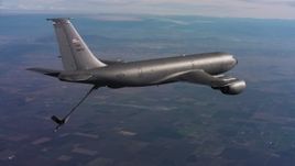 4K stock footage aerial video of a Boeing KC-135 flying with lowered refueling boom in Northern California Aerial Stock Footage | WAAF04_C011_0118FR