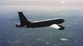 4K stock footage aerial video of a Boeing KC-135 flying over farmland in Northern California Aerial Stock Footage | WAAF04_C015_0118WU