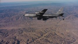 4K stock footage aerial video of a Boeing KC-135 flying over mountains in Northern California Aerial Stock Footage | WAAF04_C027_0118PJ