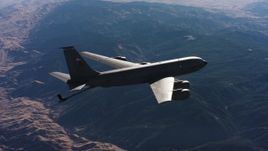 4K stock footage aerial video of a Boeing KC-135 flying over mountains, lowering refueling boom, Northern California Aerial Stock Footage | WAAF04_C029_0118JN
