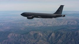 4K stock footage aerial video of tracking a Boeing KC-135 over mountains in Northern California Aerial Stock Footage | WAAF04_C049_0118DR