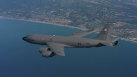 4K stock footage aerial video of a Boeing KC-135 over the ocean by the coast in Northern California Aerial Stock Footage | WAAF04_C063_0118FX