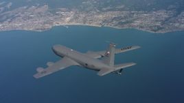 4K stock footage aerial video of a Boeing KC-135 in flight over the ocean near the coast in Northern California Aerial Stock Footage | WAAF04_C064_0118TE