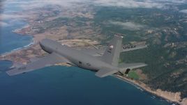 4K stock footage aerial video of revealing a Boeing KC-135 as it flies over coastal clouds in Northern California Aerial Stock Footage | WAAF04_C069_011863