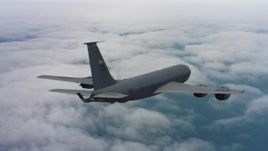 4K stock footage aerial video of a Boeing KC-135 above clouds over the Pacific Ocean in Northern California Aerial Stock Footage | WAAF04_C070_0118HE