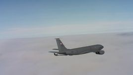 4K stock footage aerial video of a Boeing KC-135 in flight over dense clouds in Northern California Aerial Stock Footage | WAAF04_C077_0118V0