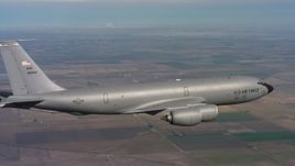 4K stock footage aerial video of a Boeing KC-135 over farmland in Northern California Aerial Stock Footage | WAAF04_C091_0118T6