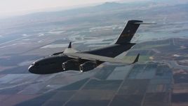 4K stock footage aerial video of a Boeing C-17 in flight over wetlands, Northern California Aerial Stock Footage | WAAF05_C013_01184S