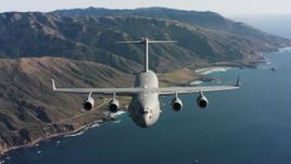 4K aerial stock footage video of reverse view of a Boeing C-17 on the coast of Northern California Aerial Stock Footage | WAAF05_C036_01183S