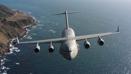 4K stock footage aerial video of a Boeing C-17 flying along the coast in Northern California Aerial Stock Footage | WAAF05_C037_0118FD