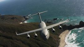 4K stock footage aerial video of a Boeing C-17 following the coastline of Northern California Aerial Stock Footage | WAAF05_C040_0118VW