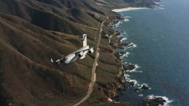 4K stock footage aerial video of a Boeing C-17 following the coast and flying out of frame, Northern California Aerial Stock Footage | WAAF05_C044_0118LQ