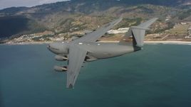 4K stock footage aerial video of a Boeing C-17 over the ocean near the coast of Northern California Aerial Stock Footage | WAAF05_C061_011867