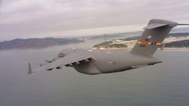 4K stock footage aerial video of a Boeing C-17 near the Golden Gate Bridge, San Francisco, California Aerial Stock Footage | WAAF05_C065_0118AG