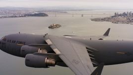4K stock footage aerial video of a Boeing C-17 flying near Alcatraz and San Francisco, California Aerial Stock Footage | WAAF05_C067_0118DB