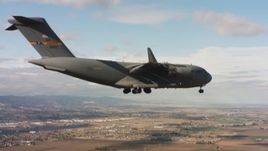 4K stock footage aerial video of a Boeing C-17 near Travis Air Force Base with landing gear down, Northern California Aerial Stock Footage | WAAF05_C076_0118DH
