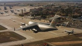 4K aerial stock footage video of a Boeing C-17 landing at Travis Air Force Base, California Aerial Stock Footage | WAAF05_C080_0118FB