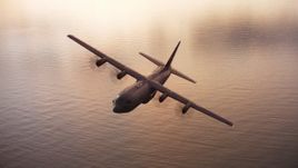 4K stock footage aerial video of a Lockheed Martin C-130J over San Francisco Bay at sunset, California Aerial Stock Footage | WAAF06_C086_011941