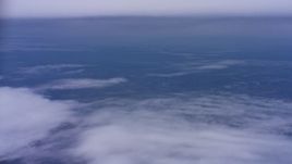 4K stock footage aerial video of patchy clouds below a tick cloud layer in Northern California Aerial Stock Footage | WAAF07_C007_0119FV