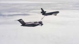 4K stock footage aerial video of a McDonnell Douglas KC-10 fueling a Boeing C-17 in flight over Northern California Aerial Stock Footage | WAAF07_C050_0119C5