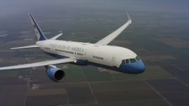 4K stock footage aerial video of a Boeing C-32 in flight above farms in Northern California Aerial Stock Footage | WAAF08_C025_0119Q7_S000