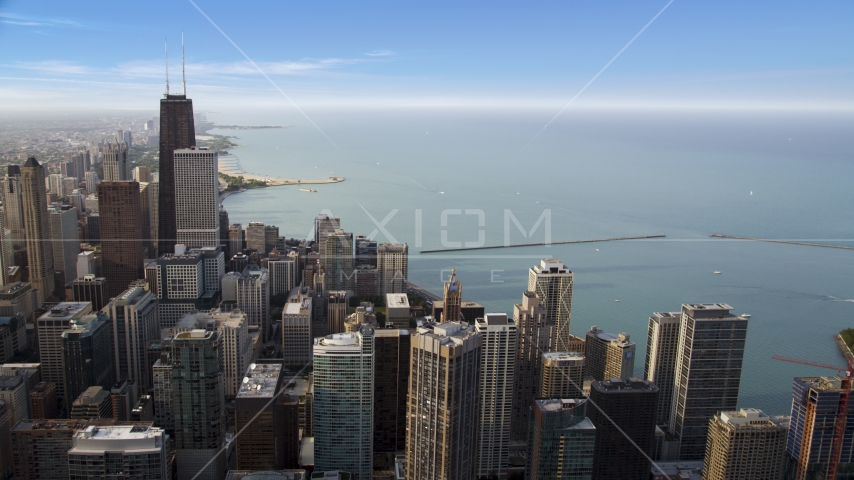 Downtown skyscrapers beside Lake Michigan in Downtown Chicago, Illinois Aerial Stock Photo AX0001_037.0000000F | Axiom Images