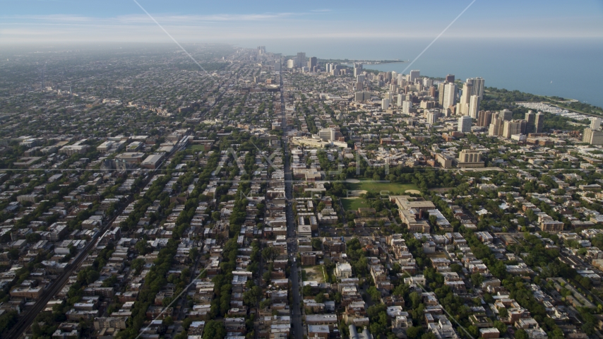 Homes and apartment buildings in the North part of Chicago on a hazy day, Illinois Aerial Stock Photo AX0001_057.0000341F | Axiom Images