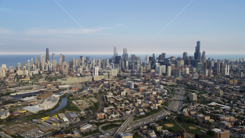 The Downtown Chicago skyline seen from the west, on a hazy day, Illinois Aerial Stock Photo AX0001_063.0000122F | Axiom Images