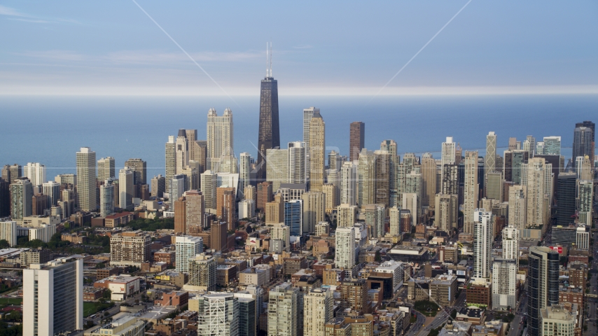 A view across the tops of Downtown Chicago skyscrapers, on a hazy day, Illinois Aerial Stock Photo AX0001_067.0000000F | Axiom Images