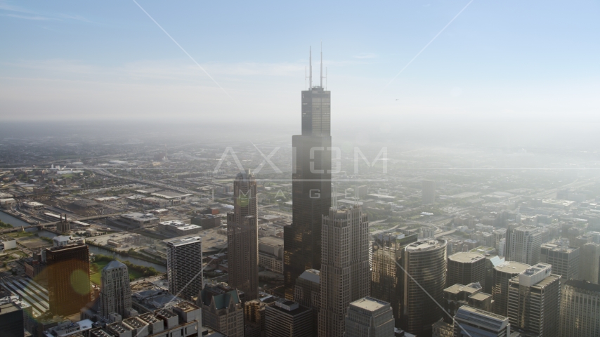 Willis Tower skyscraper on a hazy day, Downtown Chicago, Illinois Aerial Stock Photo AX0001_106.0000072F | Axiom Images