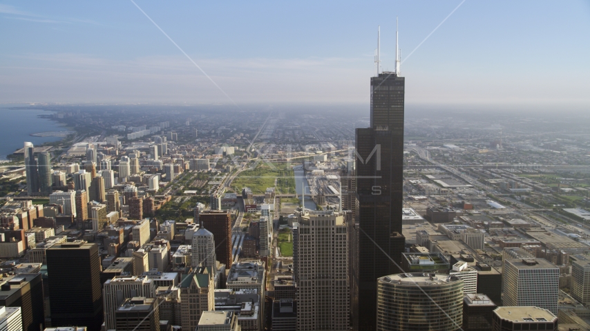 A view of Willis Tower on a hazy day in Downtown Chicago, Illinois Aerial Stock Photo AX0001_107.0000311F | Axiom Images