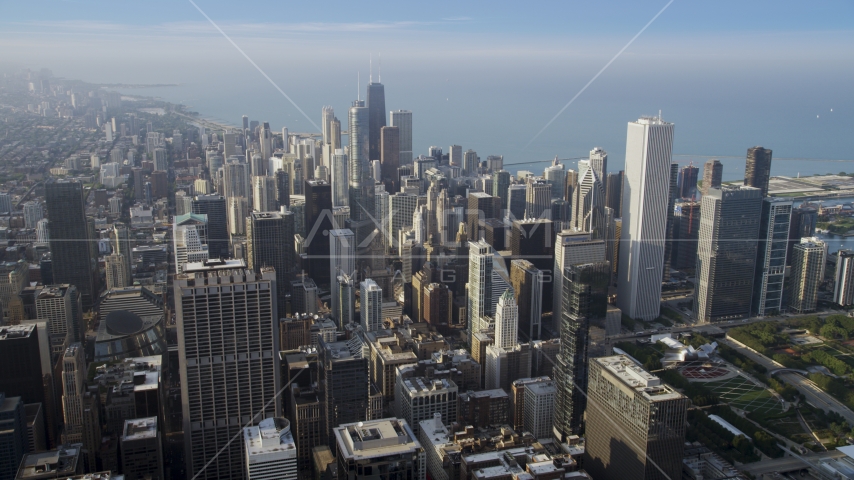 Downtown Chicago buildings and skyscrapers on a hazy day, Illinois Aerial Stock Photo AX0001_114.0000207F | Axiom Images