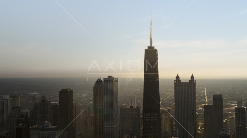 A hazy view of John Hancock Center and skyscrapers, Downtown Chicago, Illinois Aerial Stock Photo AX0001_129.0000367F | Axiom Images