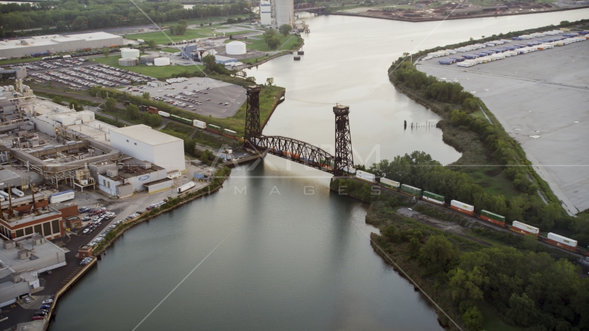 A train crossing a bridge spanning the Calumet River in Hegewisch, Chicago, Illinois Aerial Stock Photo AX0001_171.0000135F | Axiom Images
