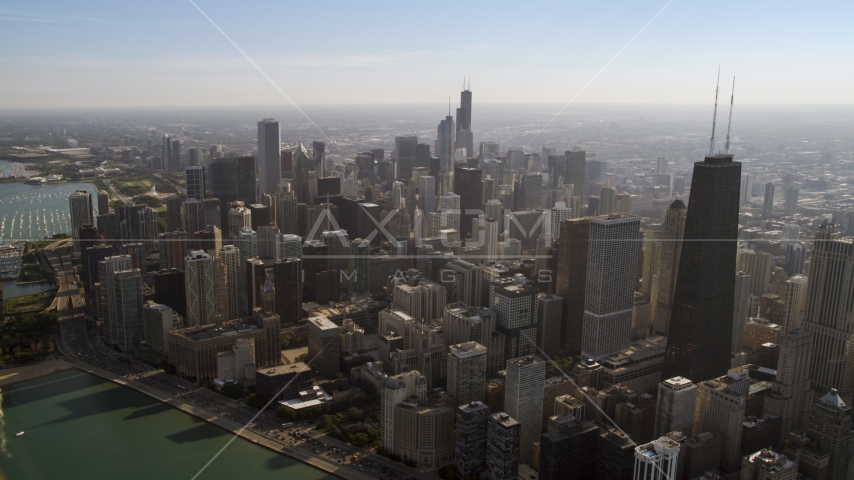 John Hancock Center and a wide view of city skyscrapers in Downtown Chicago, Illinois Aerial Stock Photo AX0002_017.0000173F | Axiom Images