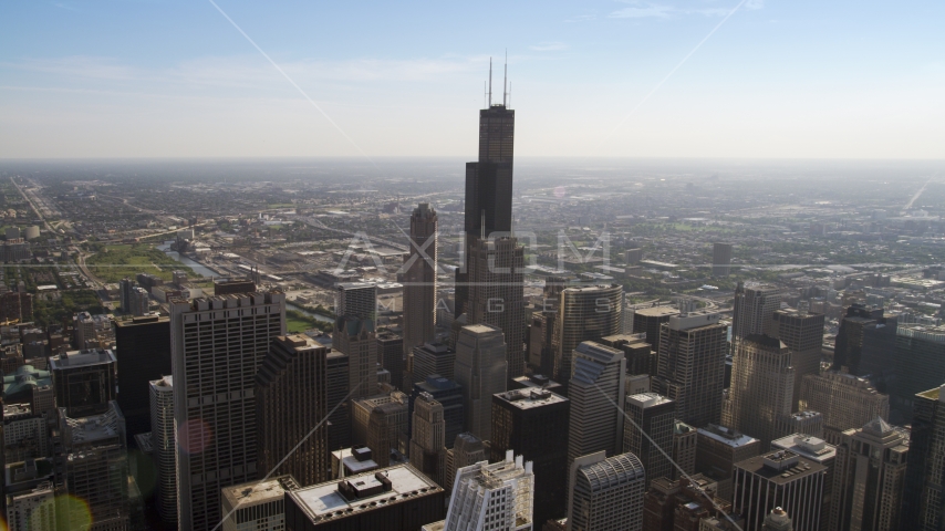 Willis Tower and surrounding skyscrapers in Downtown Chicago, Illinois Aerial Stock Photo AX0002_028.0000183F | Axiom Images