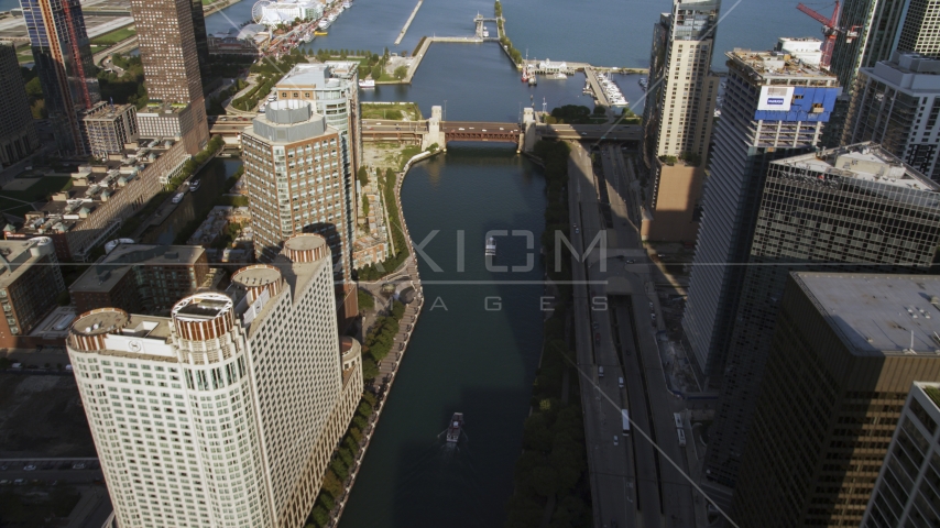 The Chicago River through Downtown Chicago and a small bridge at the mouth of the river, Illinois Aerial Stock Photo AX0002_042.0000000F | Axiom Images